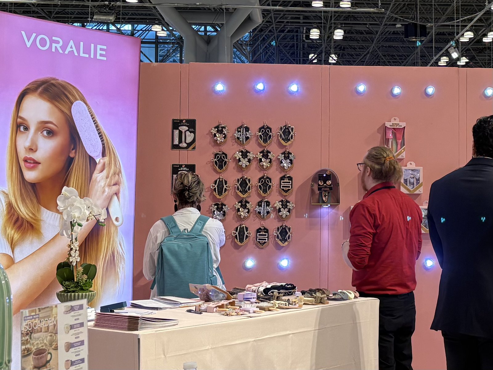 Buyers browsing VORALIE sparkle clips at NY NOW 2026